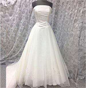 wedding dress in ivory with pink embroidery. Strapless size 14 with full organza skirt.