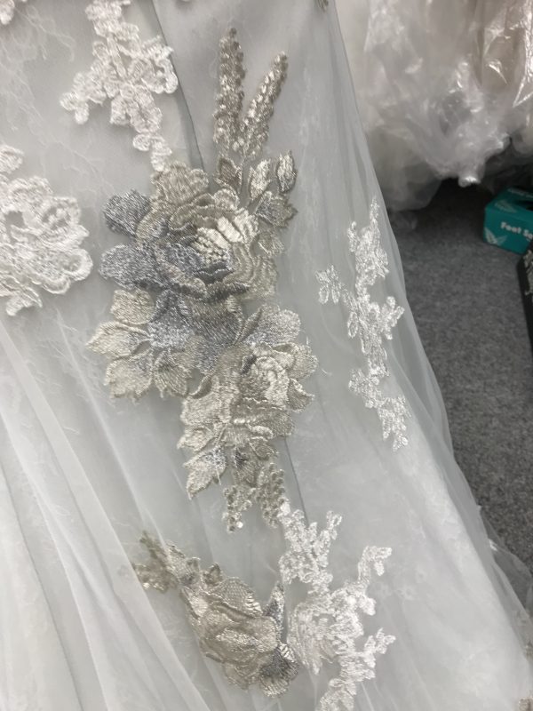 Detail of the lace on the Argent wedding dress