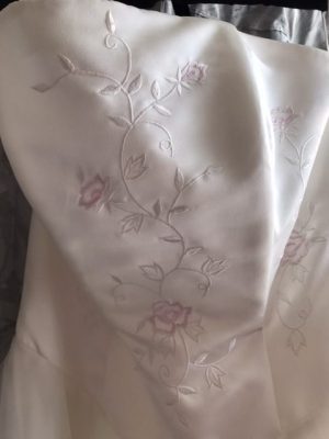 Embroidery detail in Ivory and pale pink on the Anemone wedding dress bodice