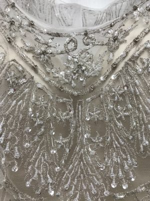 Close up showing the beading and embroidery on the Monika wedding dress