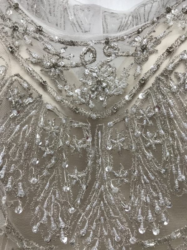 Close up showing the beading and embroidery on the Monika wedding dress