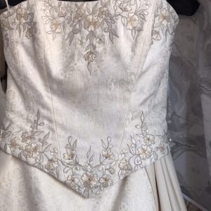 detail of the embroidery and beadwork on the brocade Palm Springs wedding dress bodice