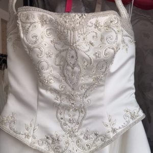 Pheodora wedding dress bodice detail showing embroidery and beadwork