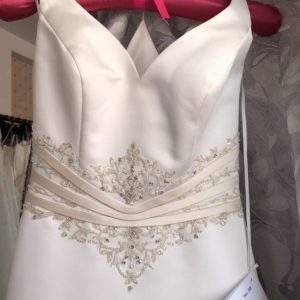 Pollyanna wedding dress bodice detail showing beadwork and satin contrast trim