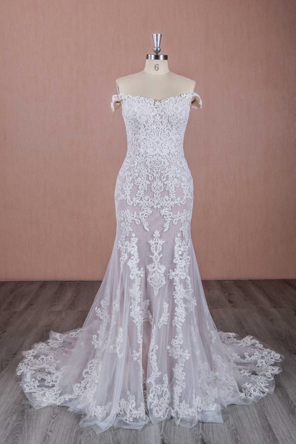 Picture of an Ivory lace wedding dress with fishtail styling