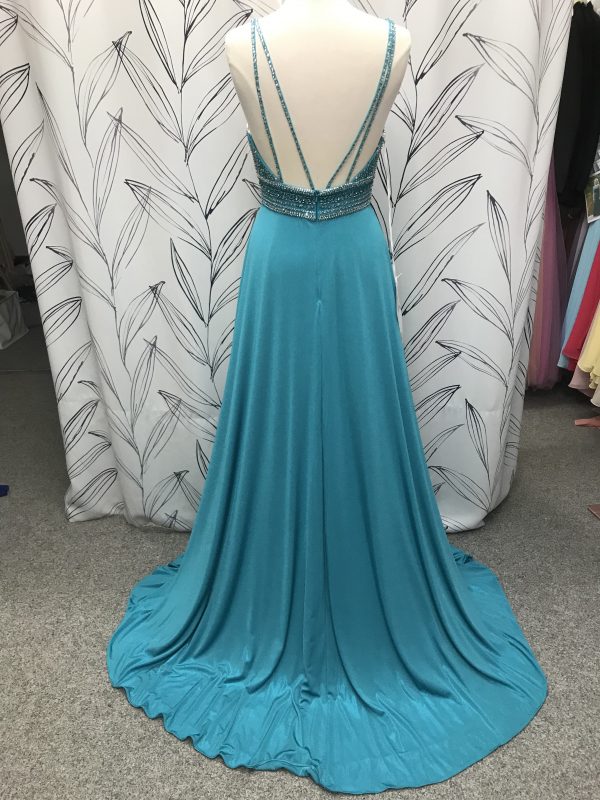 Back view of the Michaela prom dress in turquoise showing back strap detail